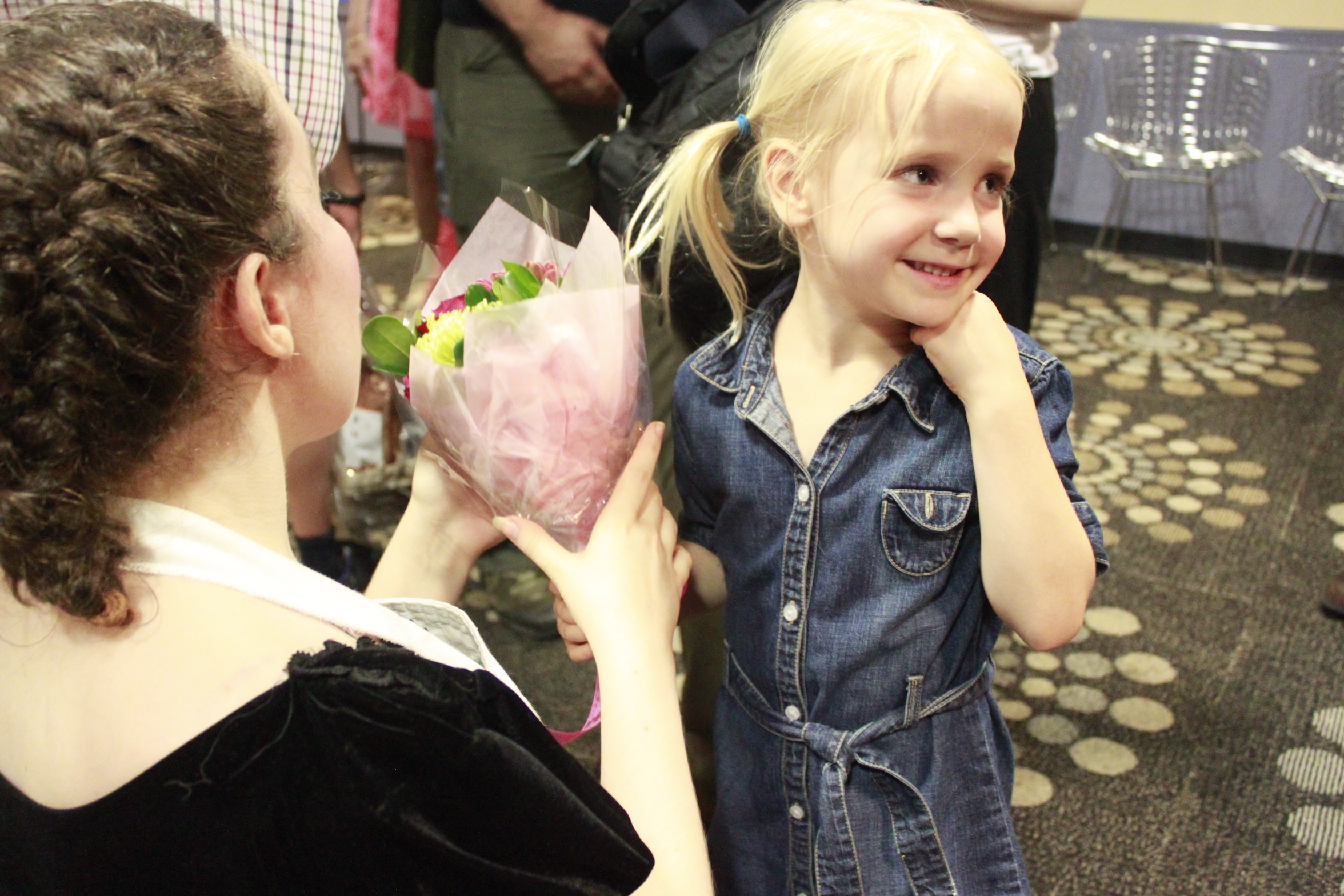 Young fan presenting flowers after a TbT show